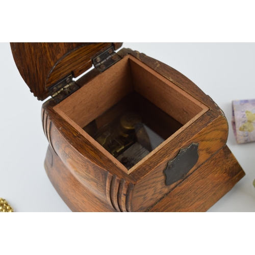 224 - An Edwardian oak barrel jewellery box with musical element with gold plated jewellery and foreign ba... 