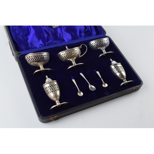 226 - Cased hallmarked silver 5 piece cruet set with pierced decoration, with assosciated silver spoons, w... 