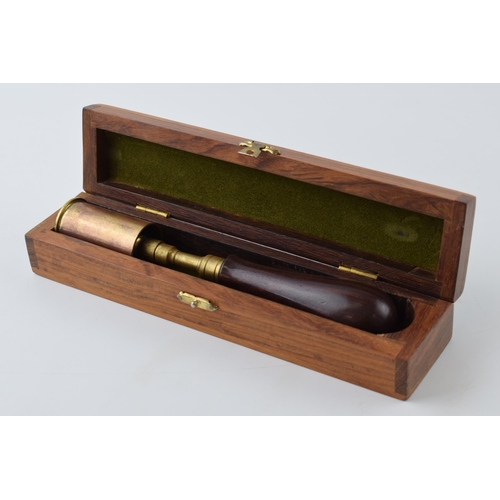 303 - Good quality rosewood handled brass shafted chamber brush with copper contained in fitted baize line... 