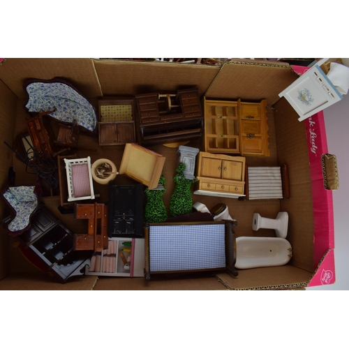 314 - A good quantity of dolls house furniture. Various items in wood and ceramics. (2 trays)