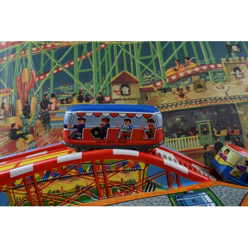 335 - A boxed Technofix Coney Island 307made in Germany tinplate and early plastic roller coaster clockwor... 