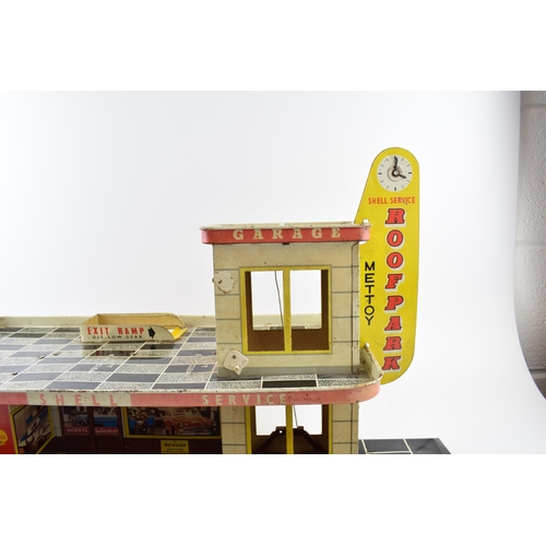 336 - Vintage Toy Service Station garage by Mettoy. Tinplate garage with the Shell Oil company logo graphi... 