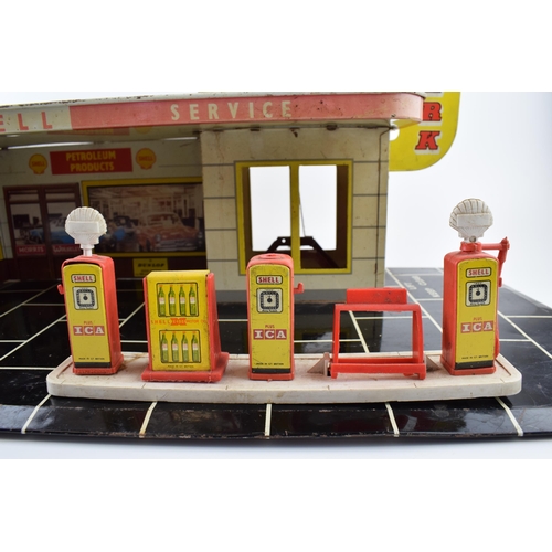 336 - Vintage Toy Service Station garage by Mettoy. Tinplate garage with the Shell Oil company logo graphi... 