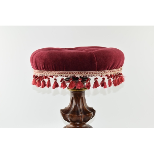 361 - 19th century upholstered piano stool with tassels and adjustable seat, on tri-carved legs with gilt ... 