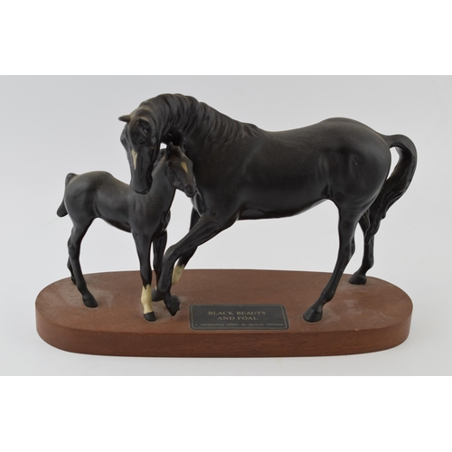 53 - Beswick Black Beauty and Foal on wooden base.