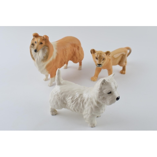 61 - Beswick to include a matte rough collie, a West Highland Terrier 2038 and a Lion cub 2098 (3).