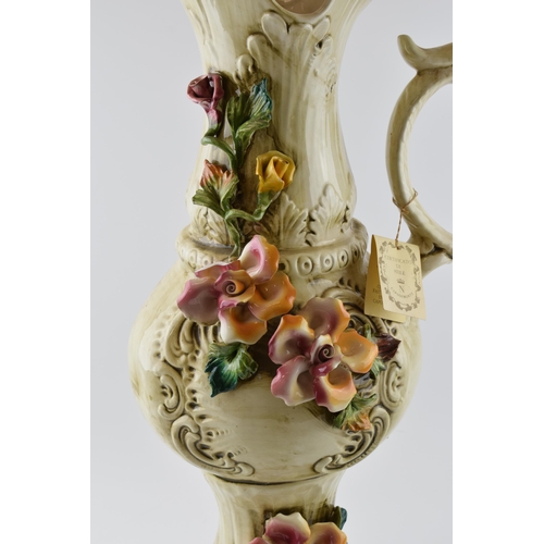 120 - Large Capo Di Monte floral jug with relief floral decoration, 66cm tall.