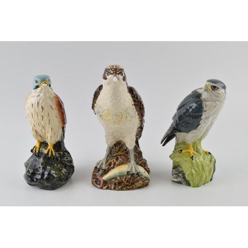 167 - A trio of Royal Doulton bird spirit decanters to include a Kestrel, a Merlin and an Osprey (3).