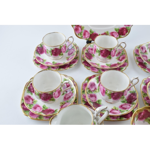 204 - Royal Albert Old English Rose to include 6 cups, 6 saucers, 6 side plates, a Treasure Chest cup, a m... 