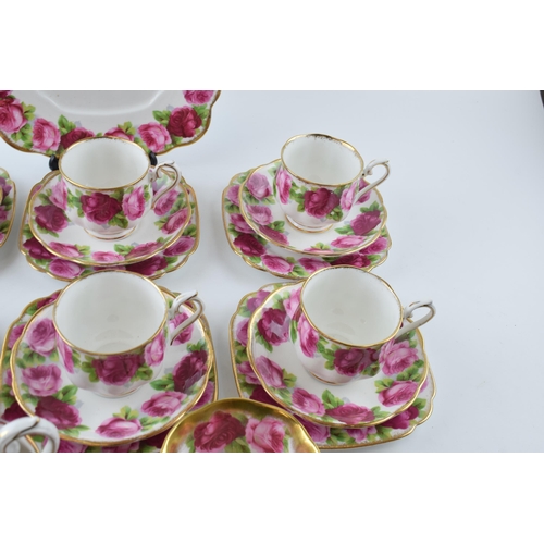 204 - Royal Albert Old English Rose to include 6 cups, 6 saucers, 6 side plates, a Treasure Chest cup, a m... 