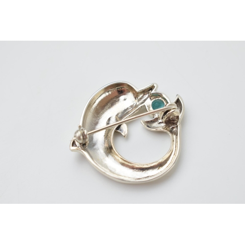 242 - Sterling silver brooch in the form of a dolphin with gemstone, in a Danish style, 36mm wide.