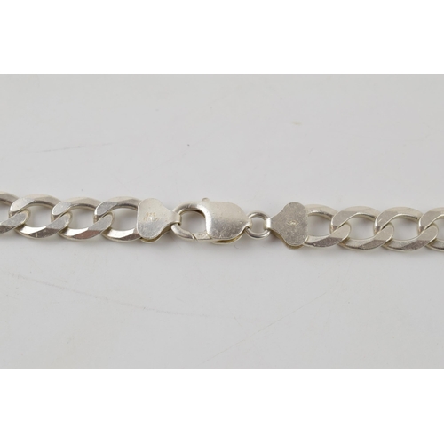 248 - Silver curb link chain with lobster claw clasp marked 925 Italy. Length including clasp 56.5cm. Weig... 