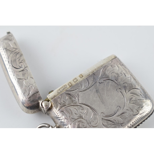 261 - Hallmarked silver vesta case with engraved decoration, 20.8 grams, Birmingham 1910.