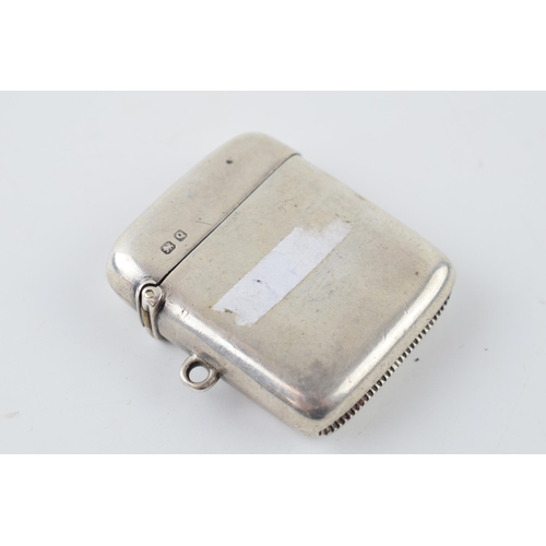 262 - Hallmarked silver vesta case with engraved decoration, 26.1 grams, Chester 1899.