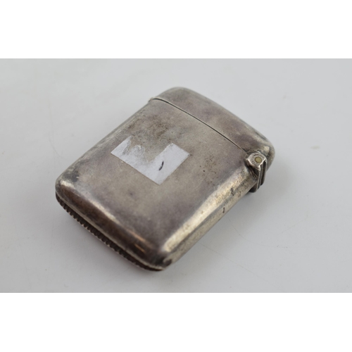 265 - Hallmarked silver vesta case with engraved decoration, 20.6 grams, Birmingham.