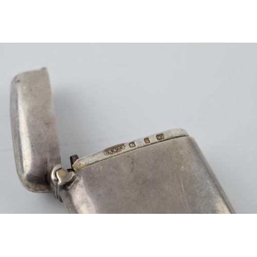 265 - Hallmarked silver vesta case with engraved decoration, 20.6 grams, Birmingham.