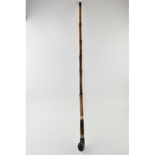 299 - Early 20th century sword stick with fullered blade and bamboo cane, with hallmarked silver hilt, hor... 