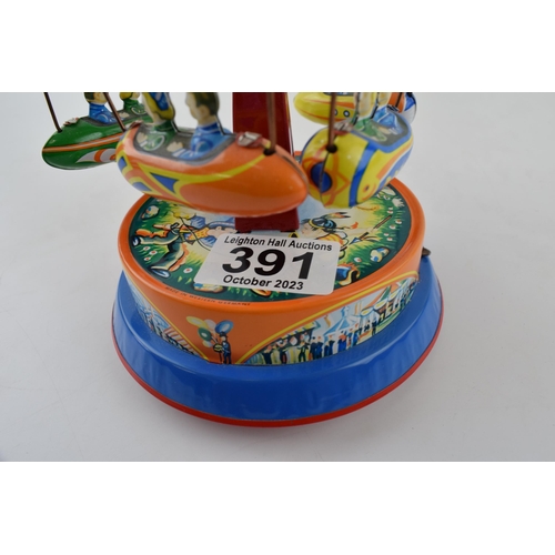 391 - Tinplate mechanical roundabout 'Spaceships Ride' . Height 19cm.