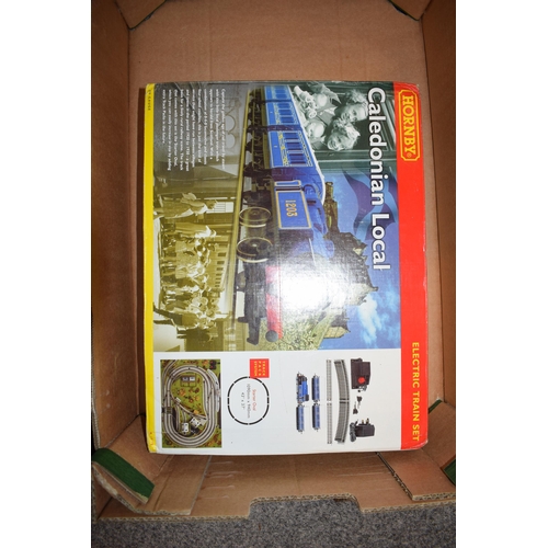 405 - A collection of boxed Hornby OO Gauge model railway items to include, Caledonian Local, BR 0-4-0 Die... 