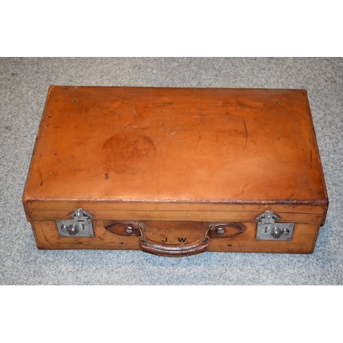 419 - An early 20th century Fortnum and Mason 'Cruzer' leather suitcase with metal fixings and leather han... 