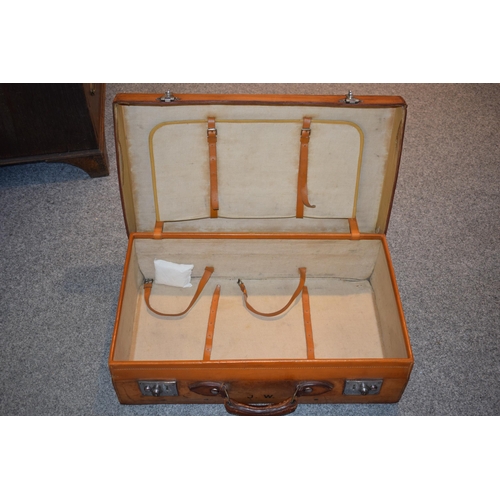 419 - An early 20th century Fortnum and Mason 'Cruzer' leather suitcase with metal fixings and leather han... 