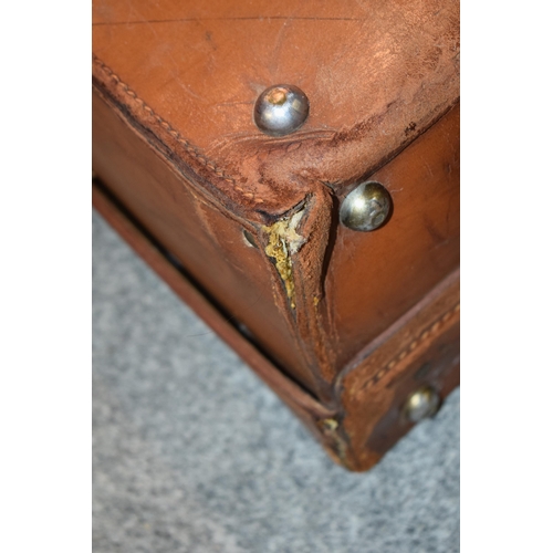 419 - An early 20th century Fortnum and Mason 'Cruzer' leather suitcase with metal fixings and leather han... 