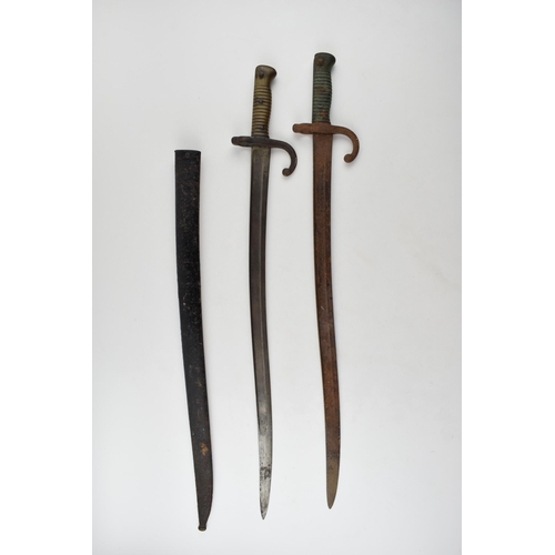 426 - 19th century French Chassepot bayonet in scabbard together with another similar example without scab... 