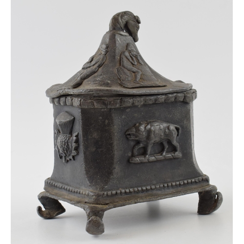 432 - 19th century lead tobacco jar with thistles motives and horses head handle.