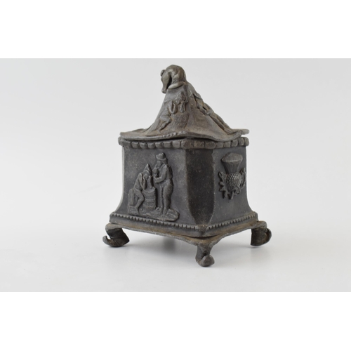 432 - 19th century lead tobacco jar with thistles motives and horses head handle.