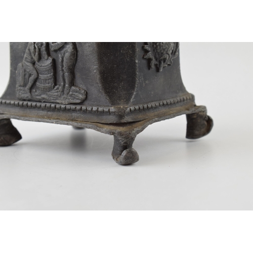 432 - 19th century lead tobacco jar with thistles motives and horses head handle.