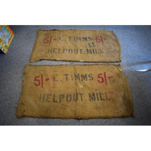 460 - Two vintage corn sacks (red writing) E. TIMMS HELP OUT. MILL 130cm x 70cm (2)