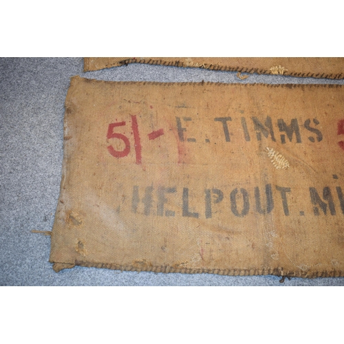 460 - Two vintage corn sacks (red writing) E. TIMMS HELP OUT. MILL 130cm x 70cm (2)