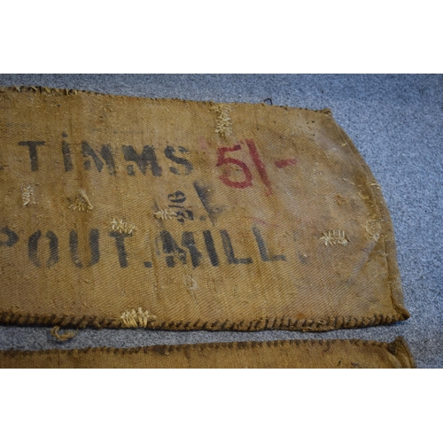 460 - Two vintage corn sacks (red writing) E. TIMMS HELP OUT. MILL 130cm x 70cm (2)