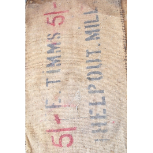 461 - Two vintage corn sacks (red writing) E. TIMMS HELP OUT. MILL 130cm x 70cm (2)