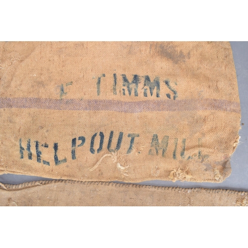 462 - Two vintage corn sacks (blue writing) E. TIMMS HELP OUT. MILL 130cm x 70cm. (2)