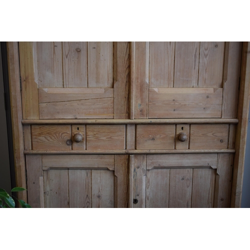 491 - Pine housekeepers cupboard / linen press with dual doors and 2 drawers, 244cm tall, 124cm wide and 3... 