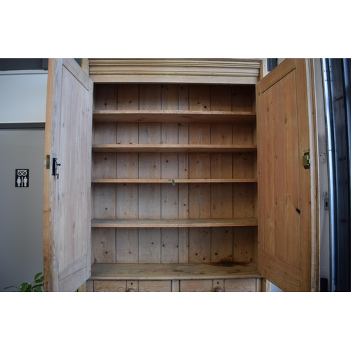 491 - Pine housekeepers cupboard / linen press with dual doors and 2 drawers, 244cm tall, 124cm wide and 3... 