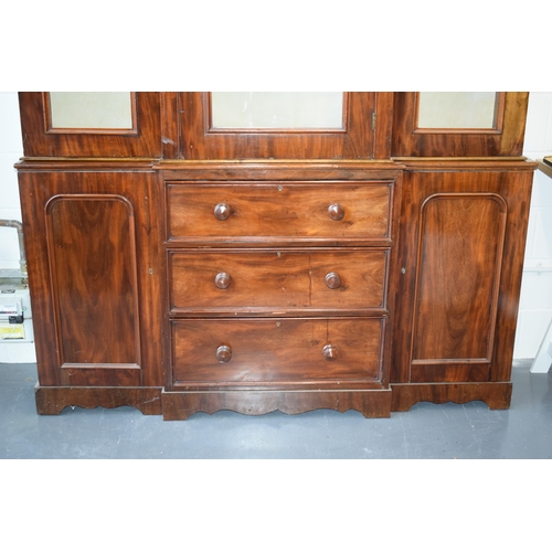 492 - 19th century mahogany breakfront sideboard / glazed bookcase with turned handles and floral carving,... 