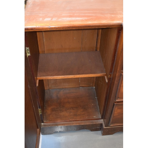 492 - 19th century mahogany breakfront sideboard / glazed bookcase with turned handles and floral carving,... 