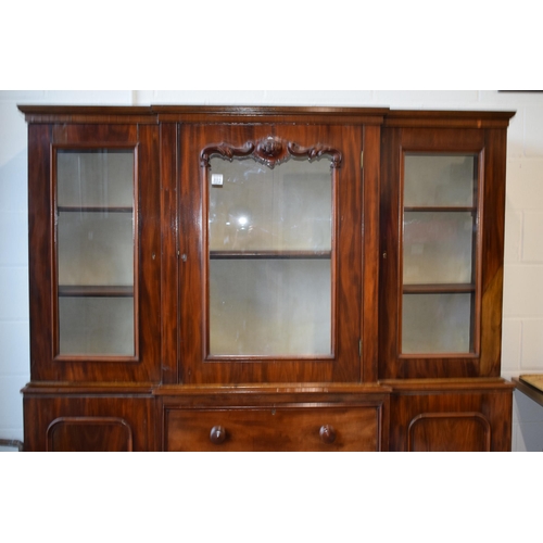 492 - 19th century mahogany breakfront sideboard / glazed bookcase with turned handles and floral carving,... 