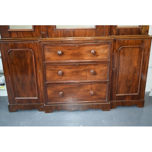 492 - 19th century mahogany breakfront sideboard / glazed bookcase with turned handles and floral carving,... 