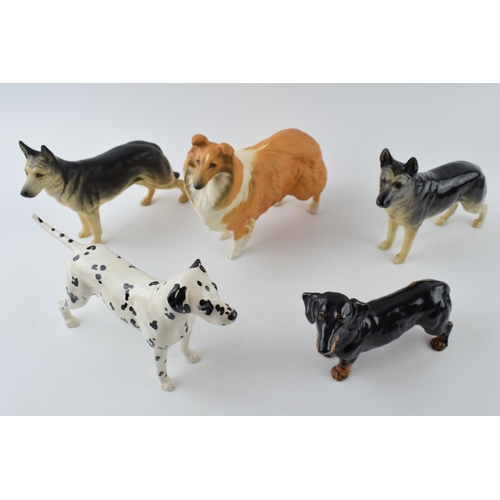 94A - A collection of large Beswick dogs to include a pair of Alsatians, a Rough Collie, a Dalmatian and a... 