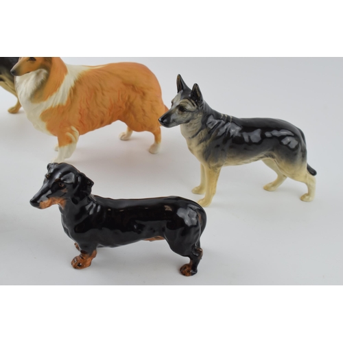 94A - A collection of large Beswick dogs to include a pair of Alsatians, a Rough Collie, a Dalmatian and a... 