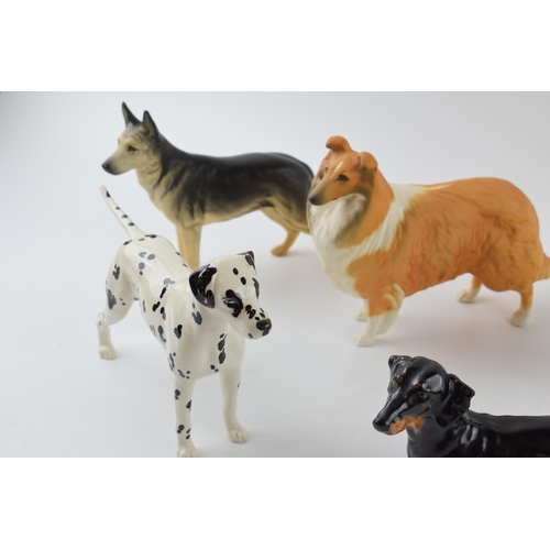 94A - A collection of large Beswick dogs to include a pair of Alsatians, a Rough Collie, a Dalmatian and a... 