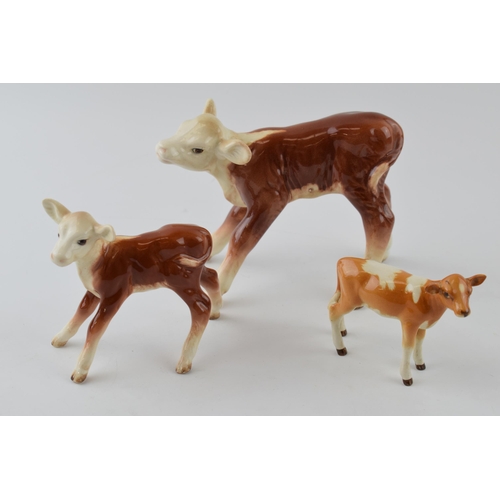 96A - A trio of Beswick calves to include a Guernsey Calf 1249A, a Hereford Calf 854 and a similar 901B (3... 