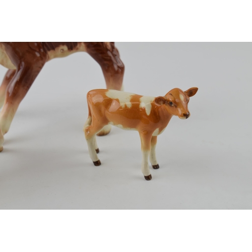 96A - A trio of Beswick calves to include a Guernsey Calf 1249A, a Hereford Calf 854 and a similar 901B (3... 