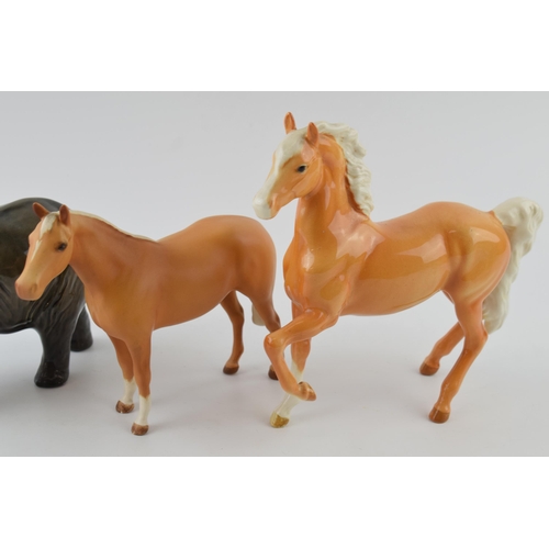 96B - Beswick to include a palomino prancing Arab 1261, an elephant 974 and a matte brown palomino thoroug... 