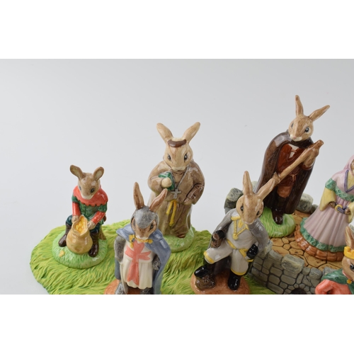 168A - Royal Doulton Bunnykins Robin Hood series: stand, and figures, comprising Friar Tuck DB246, Prince J... 