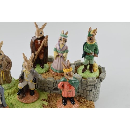 168A - Royal Doulton Bunnykins Robin Hood series: stand, and figures, comprising Friar Tuck DB246, Prince J... 