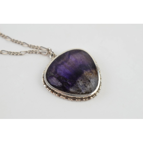 282 - Sterling silver pendant set with Blue John, 25mm tall, on a silver chain, 50cm long.